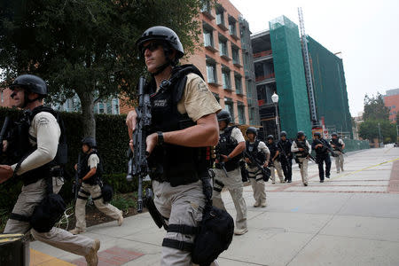 A Los Angeles Metro Police squad conducts a search on the University of California, Los Angeles (UCLA) campus after it was placed on lockdown following reports of a shooter on the campus in Los Angeles, California June 1, 2016. REUTERS/Patrick T. Fallon