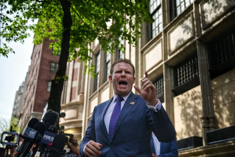 File: Andrew Giuliani, son of  Donald Trump's former personal lawyer Rudy Giuliani, speaks to the press outside his father's apartment building in New York on 28 April, 2021 (AFP via Getty Images)