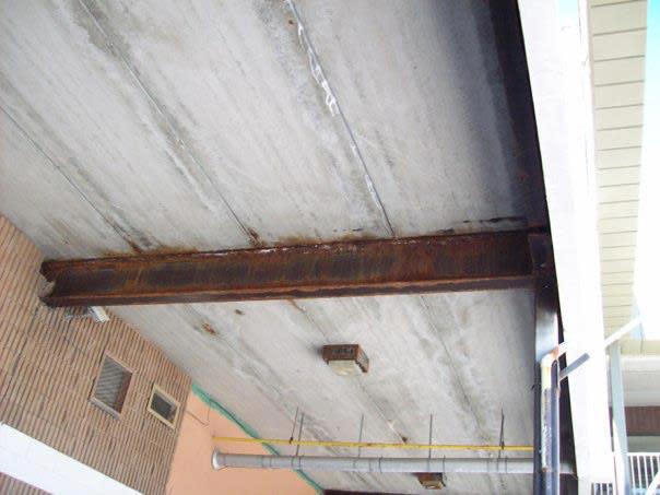 Rusted steel support beam.