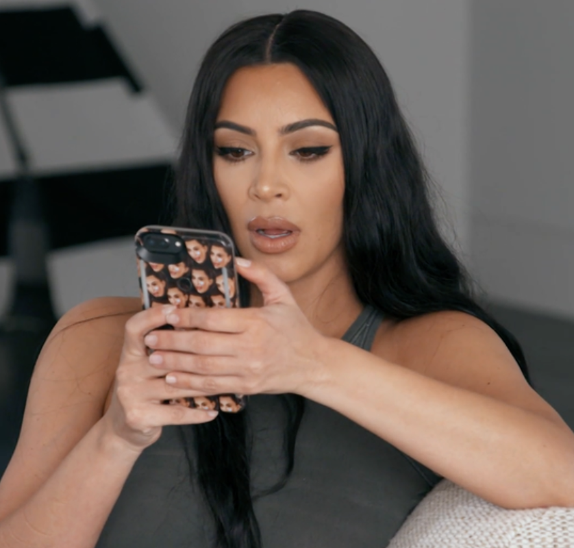 Kim Kardashian looking at her phone