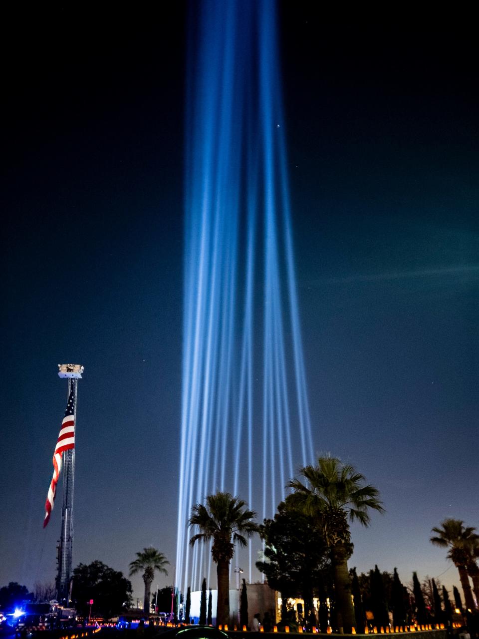 Twenty-three beams were lit one at a time as names of the dead were read out loud during the fourth-anniversary event for the victims of the 2019 Walmart mass shooting at the El Paso Community Healing Garden at Ascarate Park, Thursday, Aug. 3, 2023, in El Paso, Texas. The mass shooting by a white supremacist from Allen, Texas, left 23 dead and dozens injured.