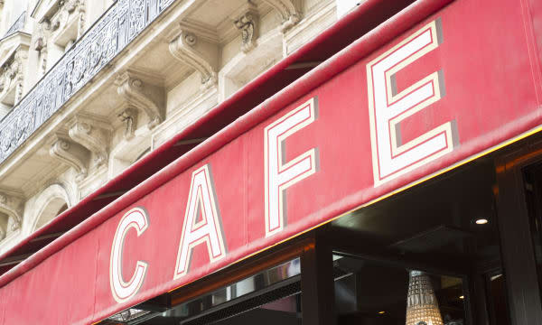 Cafe' sign awning over city street