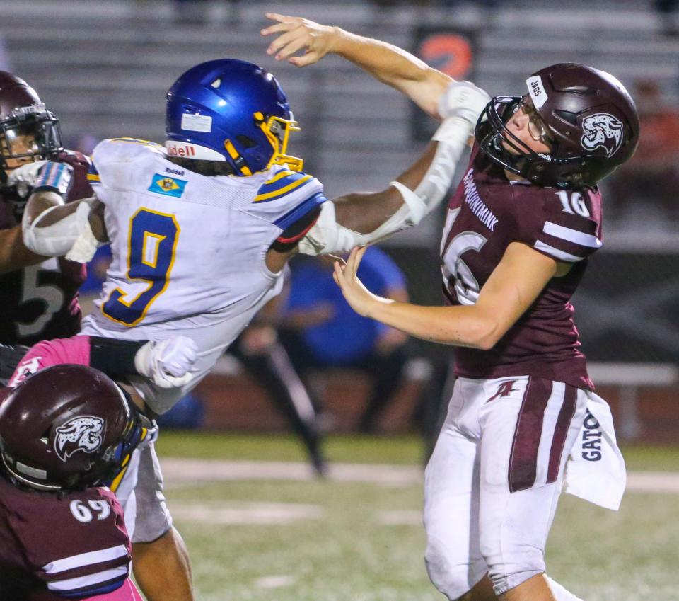 Sussex Central's Kevon Moore-Briddell pressures Appoquinimink's Greg Nielsen in the second quarter of Appoquinimink's 31-30 comeback win at home, Friday, Oct. 6, 2023.