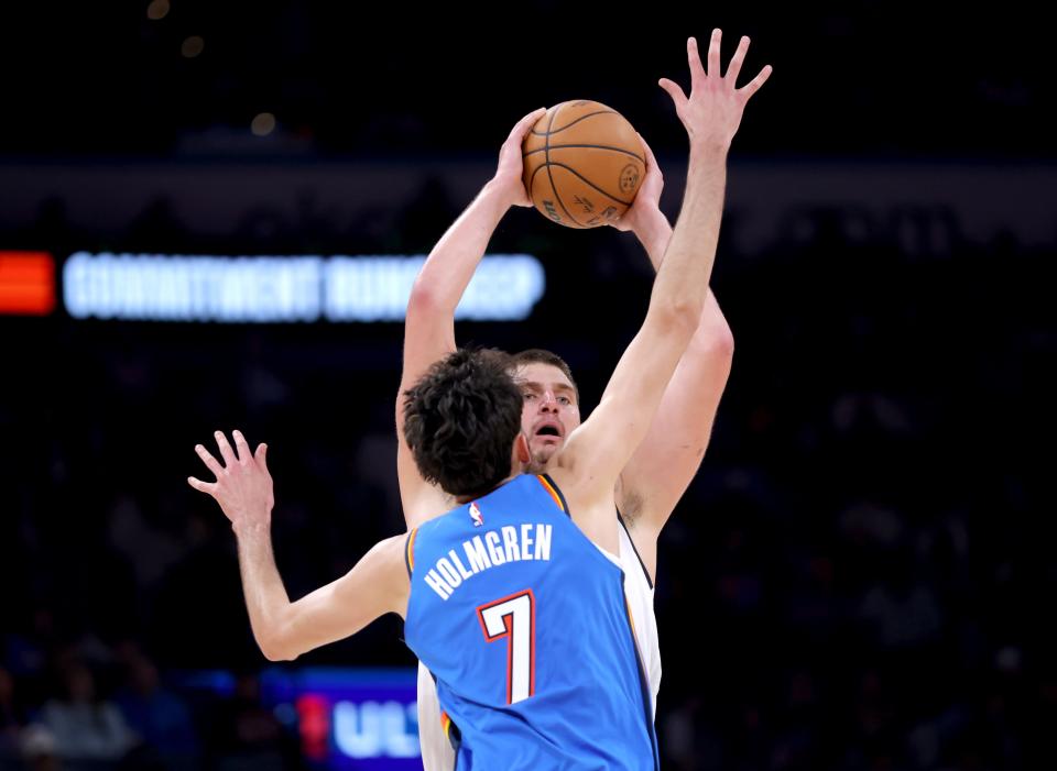 Thunder forward Chet Holmgren (7) defends against Nuggets center Nikola Jokic (15) in the second half Sunday at Paycom Center.