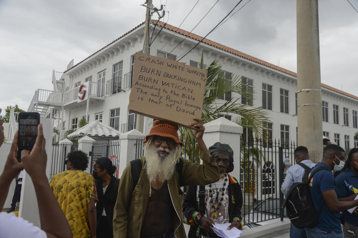 FILE - People protest to demand an apology and slavery reparations during a visit to the former British colony by the Duke and Duchess of Cambridge, Prince William and Kate, in Kingston, Jamaica, Tuesday, March 22, 2022. For many countries in the Commonwealth, a group of countries mostly consisting of former members of the British Empire, Charles’ coronation is seen with apathy at best, hostility at worst –- a painful reminder of oppression and colonialism’s bloody past. (AP Photo/Collin Reid, File)