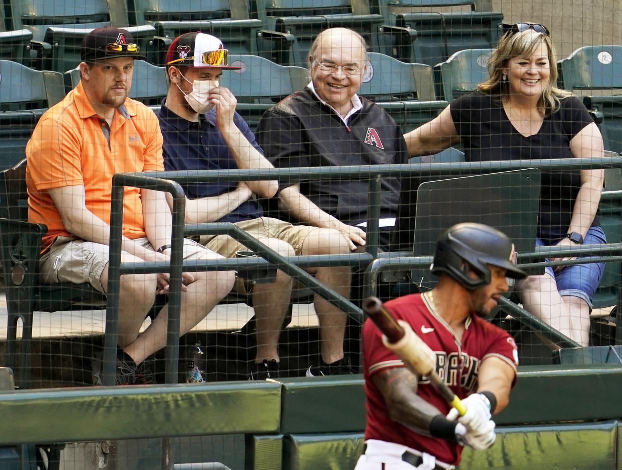 Arizona Diamondbacks owner Ken Kendrick watches David Peralta in the batting circle in the third inning during a spring training game against the Cleveland Indians at Chase Field in Phoenix on March 30, 2021.