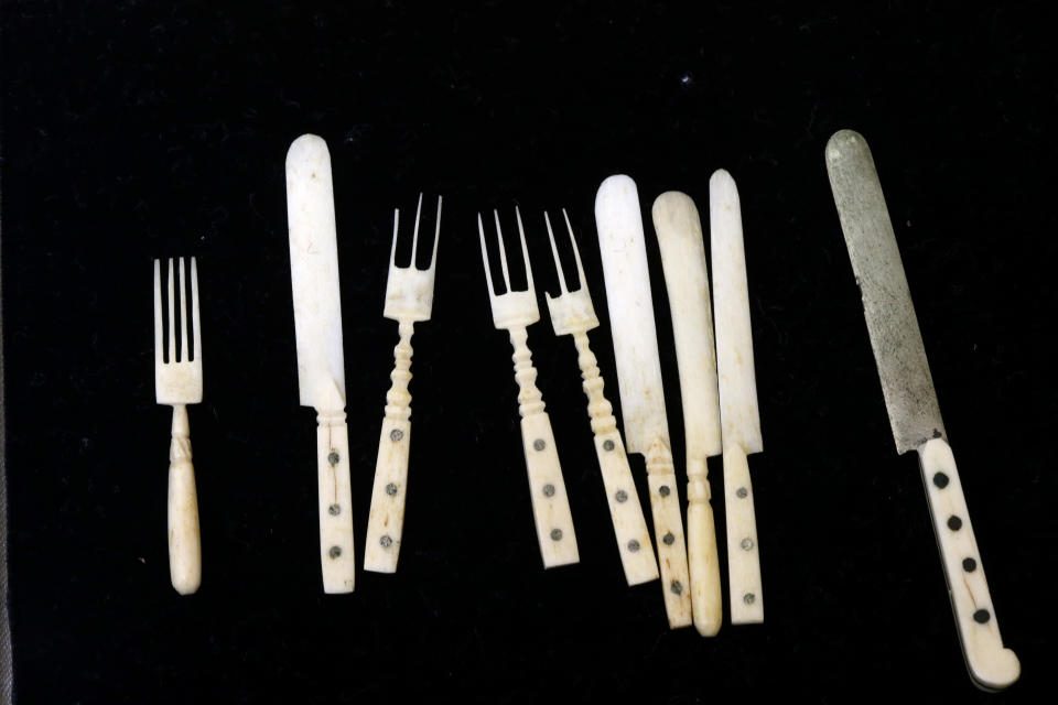 In this Tuesday, March 12, 2013 photo, shown is a miniature cutlery set made from bones in an unknown inmate’s soup at the Eastern State Penitentiary in Philadelphia. The defunct and decayed prison that serves as one of Philadelphia's quirkiest tourist attractions, plans to displaying dozens of never-before-seen artifacts for 10 days only in a "pop-up museum." (AP Photo/Matt Rourke)