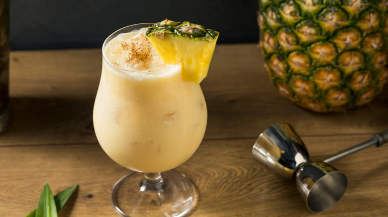 Painkiller cocktail with pineapple garnish