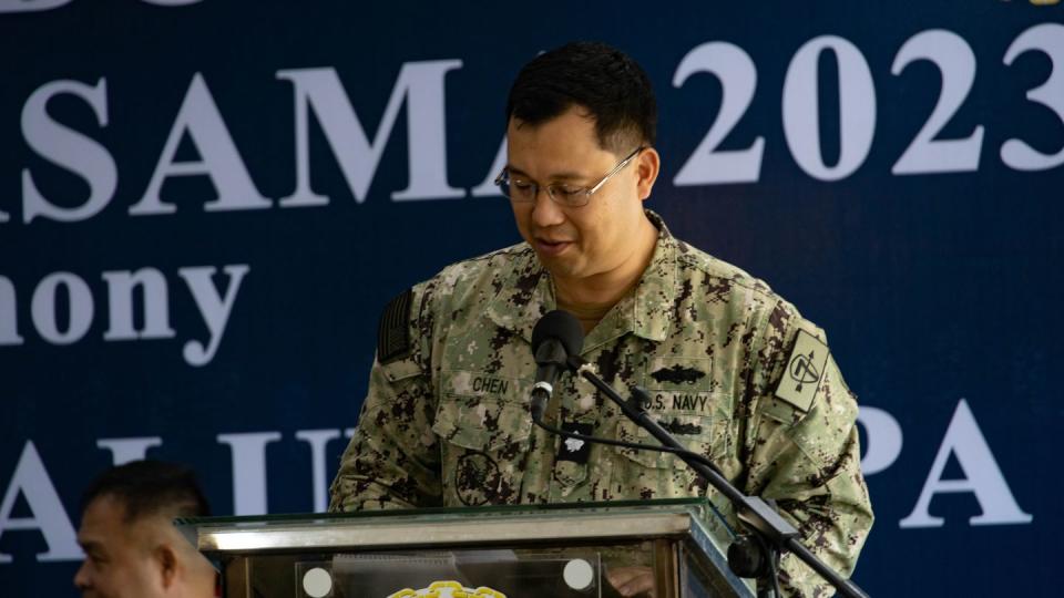 U.S. Navy Cmdr. Jun Chen, a foreign area officer with Destroyer Squadron 7, speaks at the closing ceremony of Sama Sama in the Philippines on Oct. 13, 2023. (Staff Sgt. Kai W. Huber/U.S. Marine Corps)