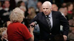 Sen. John McCain defends then-Sen. Barack Obama to a supporter who called him an "Arab" during a 2008 town hall event in Lakeville, Minn.