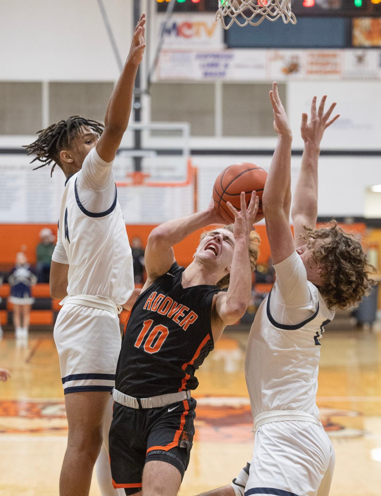 Hoover's Zac Braucher splits Hoban's defense in the first half.