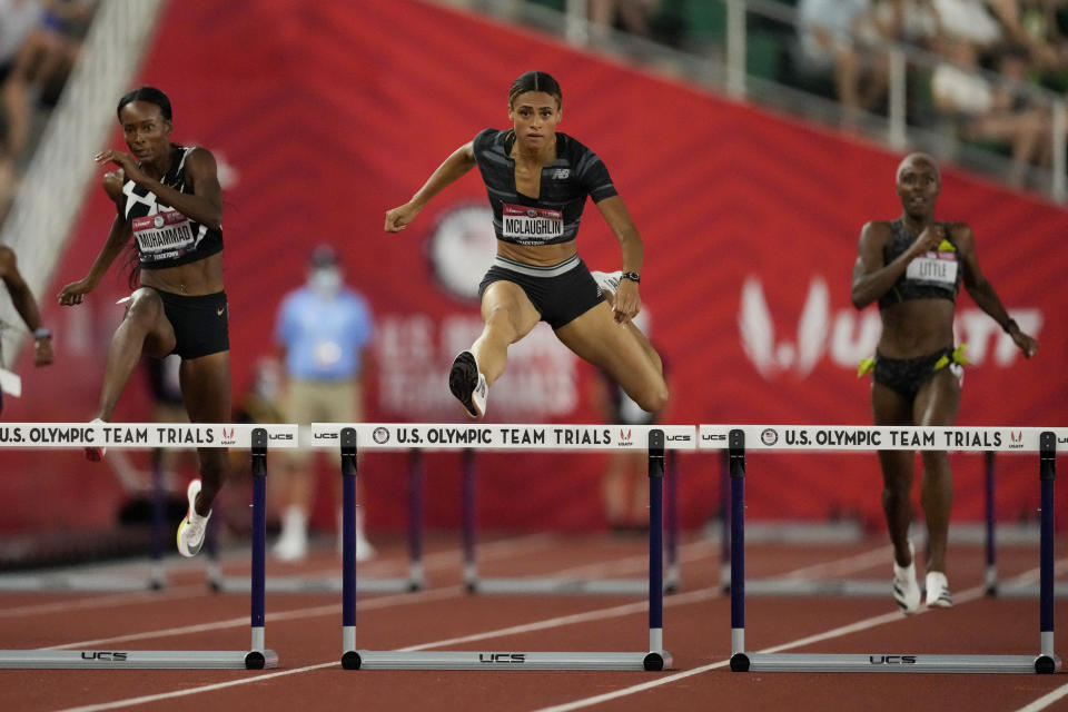 FILE - In this June 27, 2021, file photo, Sydney McLaughlin sets a new world record in the finals of the women's 400-meter hurdles at the U.S. Olympic Track and Field Trials in Eugene, Ore. One of the most entertaining races at the upcoming Tokyo Games figures to be the women’s 400 hurdles, where McLaughlin set a new world record by edging Dalilah Muhammad at the U.S. track trials. (AP Photo/Ashley Landis, File)