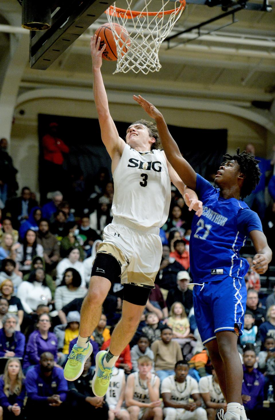 Sacred Heart-Griffin's Jake Hamilton goes up for a shot during the game against Douglas MacArthur on Friday.