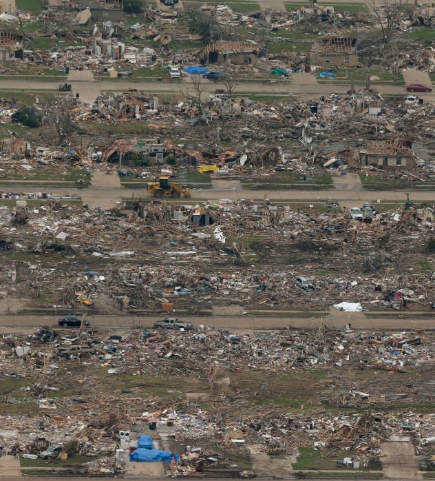 Tornado-damaged areas of Moore, Oklahoma, are seen in aerial photos during a mission flown by the Civil Air Patrol Sunday, May 26, 2013. Cleanup continues after a huge tornado roared through the Oklahoma City suburb Monday, flattening a wide swath of homes and businesses. (AP Photo/Charlie Riedel)