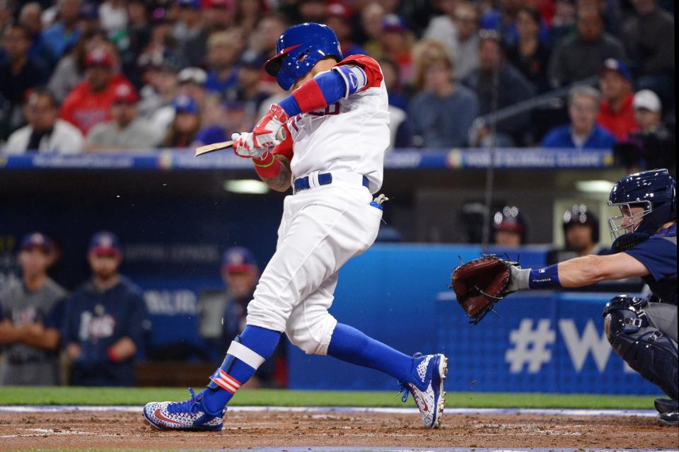 Puerto Rico infielder Javier Baez (9) hits a broken-bat RBI single in the first inning against the United States during the 2017 World Baseball Classic at Petco Park in San Diego, on March 17, 2017.