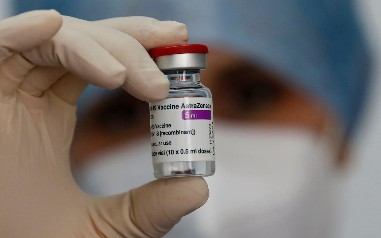 A health worker holds up a dose of the AstraZeneca vaccine against COVID-19 to be administered to members of the Italian Army at a vaccination center set up at the military barracks of Cecchignola, in Rome, Tuesday, Feb. 23, 2020. (Cecilia Fabiano/LaPresse via AP) - Cecilia Fabiano/LaPresse