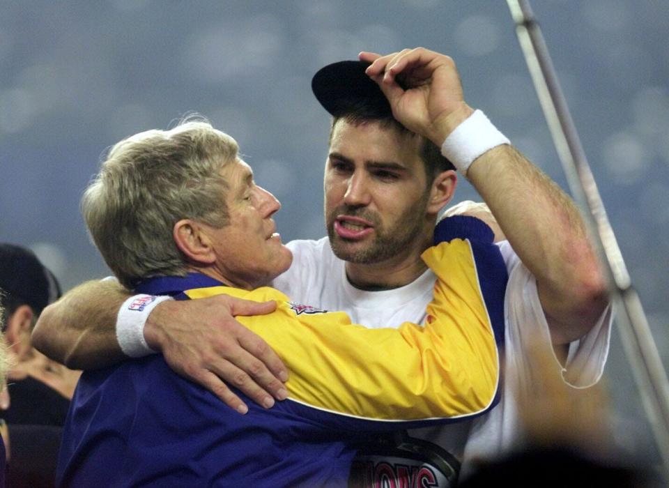 The real deal: Rams quarterback Kurt Warner hugs head coach Dick Vermeil following their Super Bowl victory.