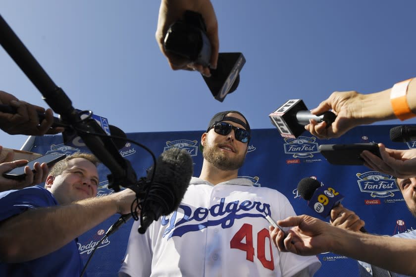 Los Angeles Dodgers' pitcher Jimmy Nelson is interviewed by reporters during Dodger Stadium FanFest.