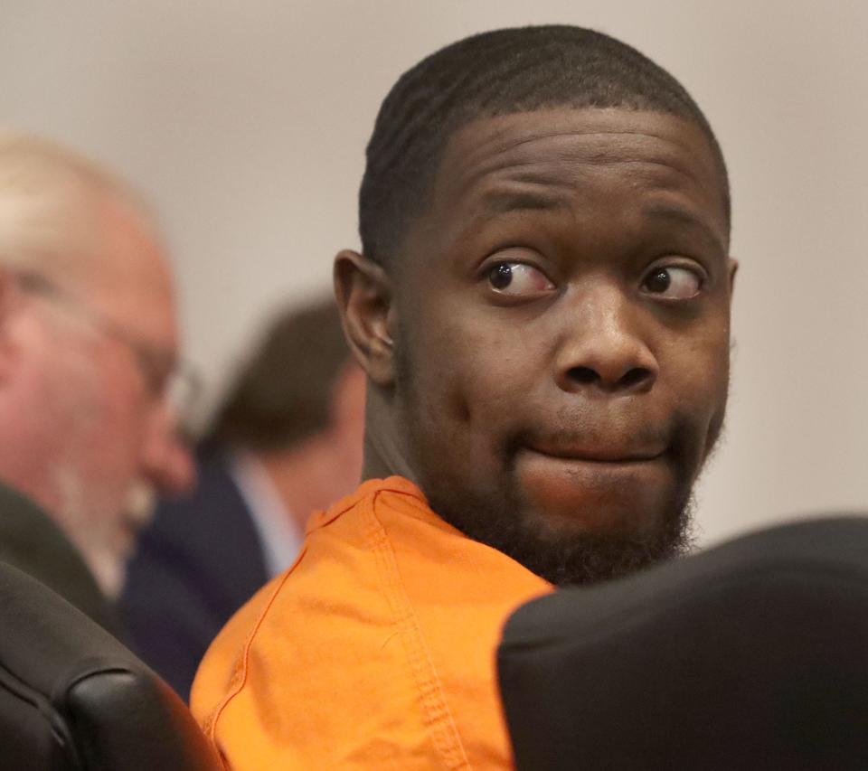 Defendant Othal Wallace, who is accused of killing a Daytona Beach police officer, looks around the courtroom, Friday, July 28, 2023, during a hearing at the S. James Foxman Justice Center in Daytona Beach.