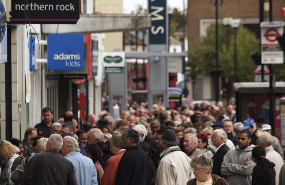 FILE - In this Sept. 17, 2007 file photo, customers stand in a queue outside a branch of the Northern Rock bank in Harrow, London. The bank experienced a run amid fears it was to collapse. It proved to be an early signal of the global financial crisis, which was one of the greatest to afflict Britain in the postwar period, the latest of which relates to the country's struggles in leaving the European Union. (AP Photo/ Max Nash, File)