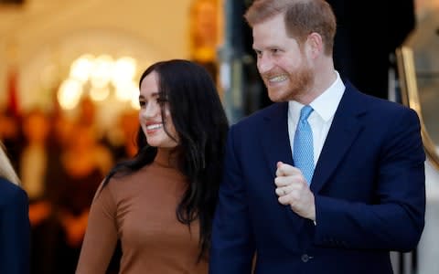 Harry and Meghan, Duchess of Sussex leave after visiting Canada House in London after their recent stay in Canada. - Credit: AP