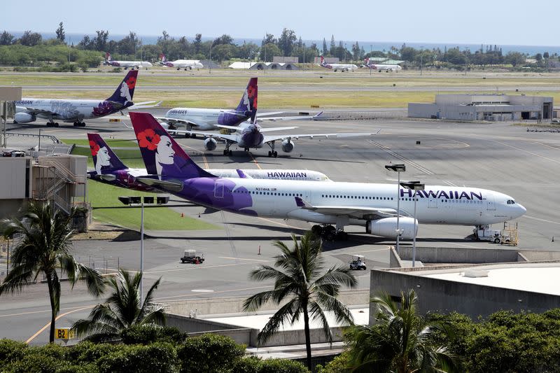 FILE PHOTO: Hawaiian Airlines airplanes sit idle on the runway at the Daniel K. Inouye International Airport due to the business downturn caused by the coronavirus disease (COVID-19) in Honolulu