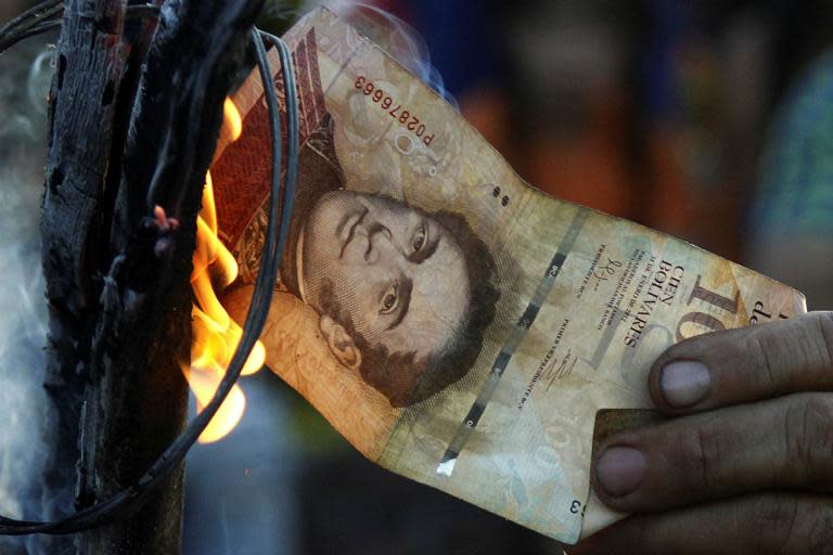 Venezuela lops five zeros off its currency in bid to tackle hyperinflation