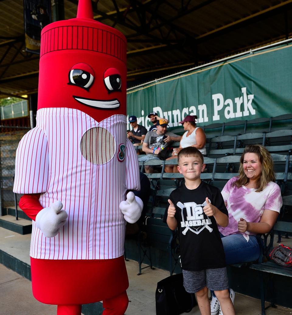 The Spartanburgers played the Savannah Bananas in Coastal Plain League baseball at Duncan Park on June 10. These are the fans that came out to support the teams and local baseball.  Callan Corbin, 7, of Spartanburg greets team's mascot Tom 8-0. 