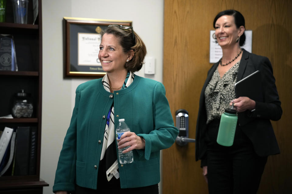 U.S. Deputy Attorney General Lisa Monaco, front, and Colette Peters, director of the federal Bureau of Prisons, enter an interview Tuesday, April 25, 2023, in Aurora, Colo. Monaco says teams of experts and officials will soon be fanning out to women’s prisons around the country to follow up on reforms the agency adopted last fall on sexual abuse in the nation's federal prisons. Fundamental change in the Bureau of Prisons culture is part of a new mission statement announced Tuesday by Peters, who was hired last year after her predecessor resigned amid mounting pressure from Congress. (AP Photo/David Zalubowski)