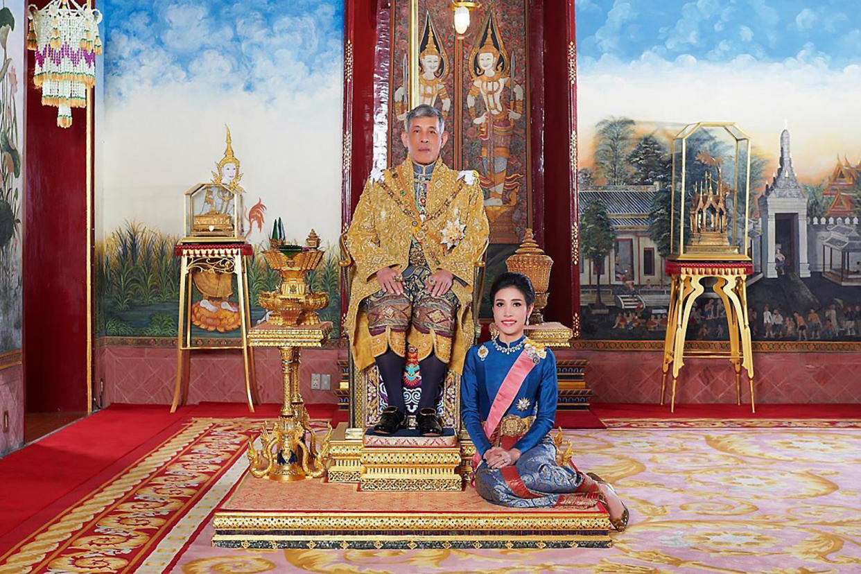 This undated photo posted Monday, Aug. 26, 2019 on the Thailand Royal Office website shows King Maha Vajiralongkorn with Major General Sineenatra Wongvajirabhakdi, the royal noble consort. She was bestowed the title of Chao Khun Phra Sineenatra Bilasakalayani by King Maha Vajiralongkorn during a ceremony in late July.  In May the king named another woman Suthida Vajiralongkorn Na Ayudhya as the queen of Thailand. (Thailand Royal Office via AP)