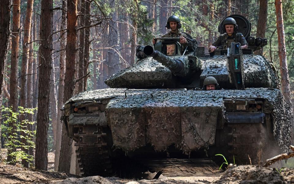 Ukrainian servicemen gather near Kharkiv on Tuesday