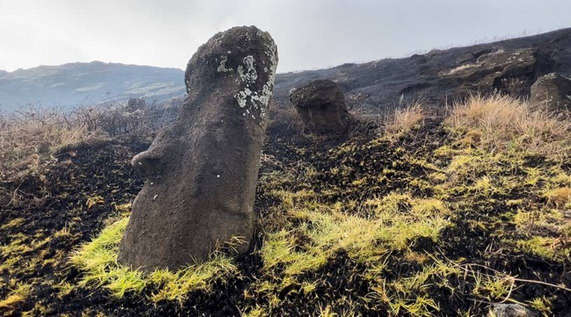 Fire damage can be seen on the Moai statue, the land around it scorched and brown.