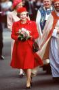 <p>She sports a red dress, coat, and matching pillbox hat for a visit to Saint Anne's Church.</p>