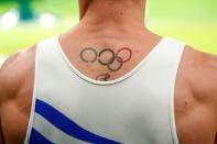 Aug 15, 2016; Rio de Janeiro, Brazil; A view of the tattoo Eleftherios Petrounias (GRE) before the men's rings finals in the Rio 2016 Summer Olympic Games at Rio Olympic Arena. Mandatory Credit: Mandatory credit: Andrew P. Scott-USA TODAY Sports