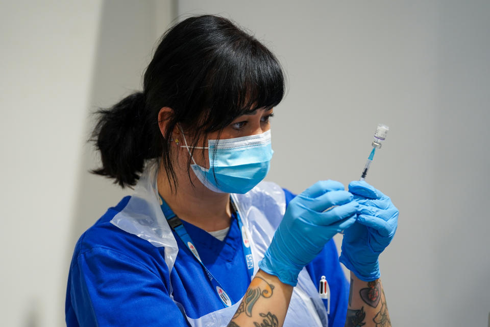 <p>A member of staff prepares a Covid-19 Pfizer jab at a pop-up vaccination centre at Westfield Stratford City shopping centre in east London, where TikTok are encouraging young Londoners to get jabbed. Picture date: Saturday October 2, 2021. (Photo by Kirsty O'Connor/PA Images via Getty Images)</p>
