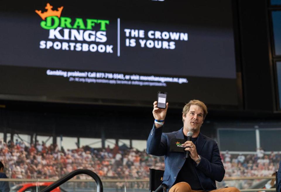 Panthers legend Greg Olsen makes the first bet on DraftKings as sports betting goes live in North Carolina at NASCAR Hall of Fame in Charlotte, N.C., on Monday, March 11, 2024.