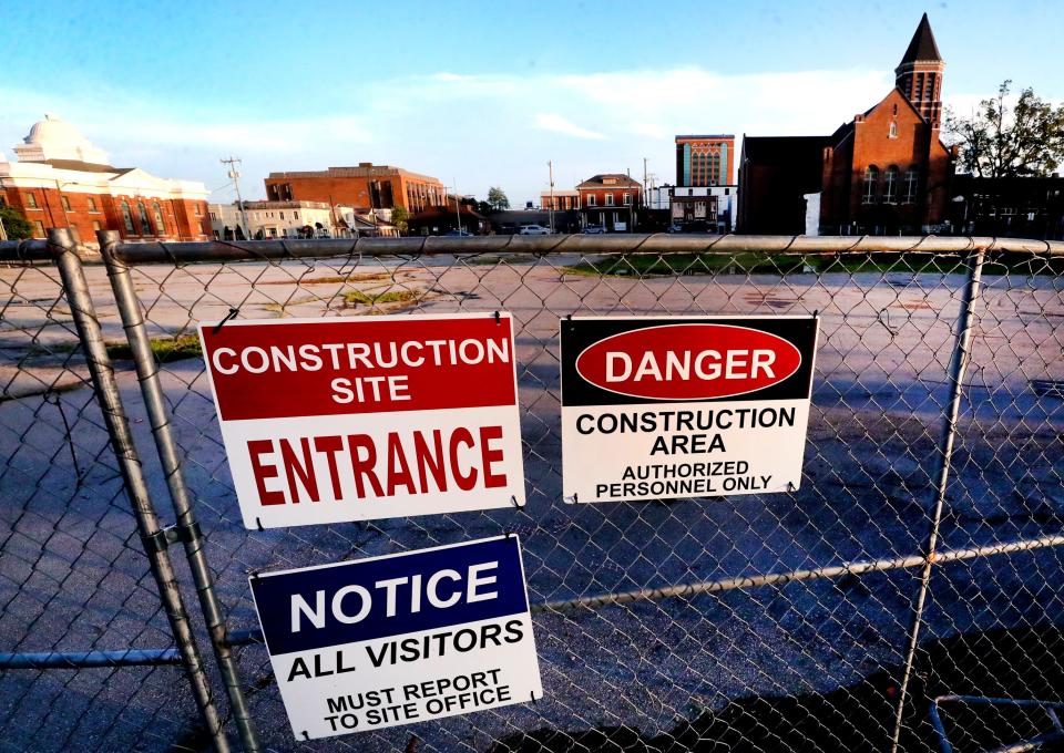 Signs hang from the fence surrounding the historic former First United Methodist Church and a former city parking lot in downtown Murfreesboro, on Thursday, July 20, 2023. Developers plan a mixed-use redevelopment of the property with 163 apartments, 28 condos, offices, retail spaces, and a 490-space parking garage. The project also will preserve the church sanctuary by using the space as a restaurant or event center.