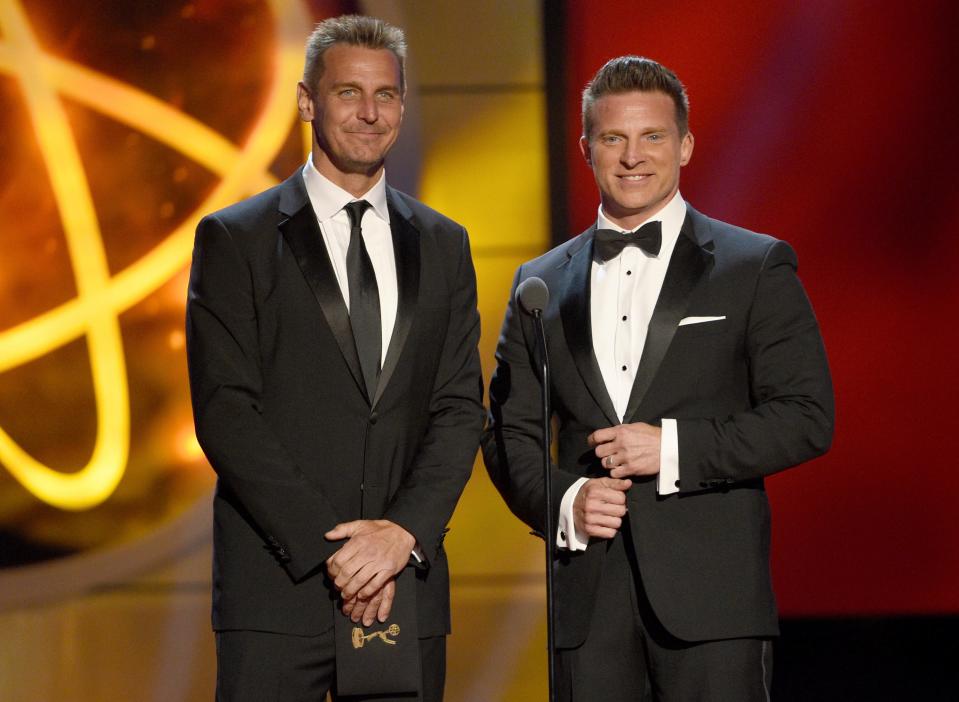 Ingo Rademacher, left, and Steve Burton present the award for outstanding lead actress in a drama series at the 46th annual Daytime Emmy Awards at the Pasadena Civic Center on Sunday, May 5, 2019, in Pasadena, Calif. (Photo by Chris Pizzello/Invision/AP) ORG XMIT: CARA593 [Via MerlinFTP Drop]