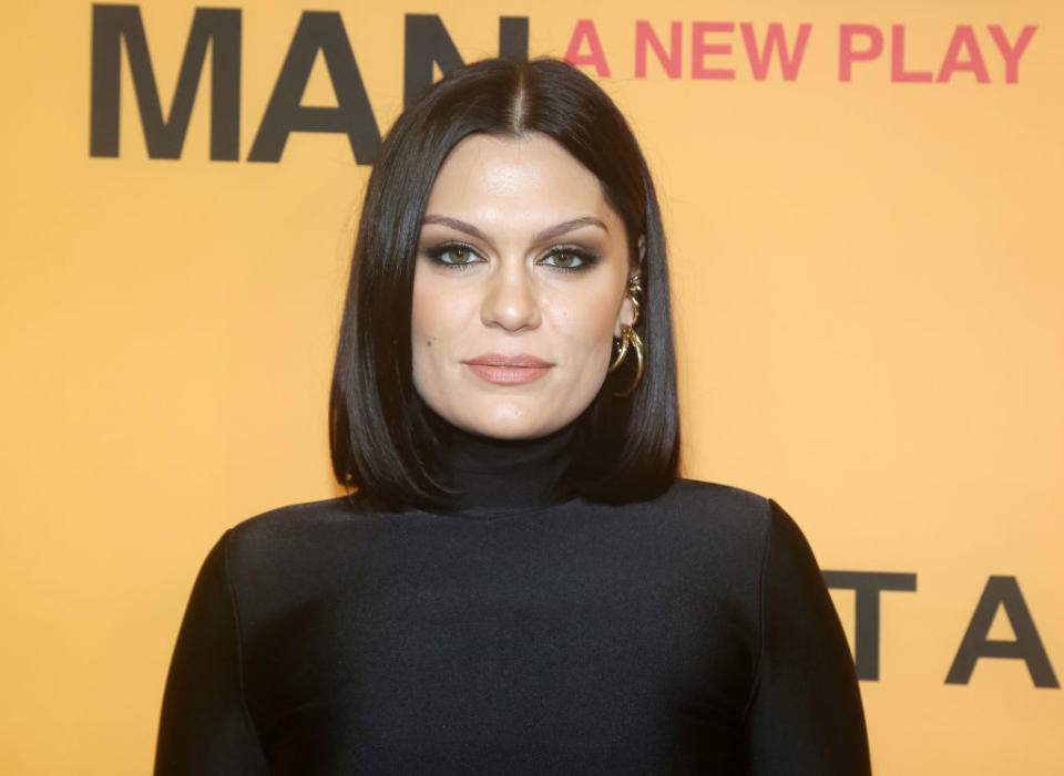 Close-up of Jessie at a media event in a turtleneck