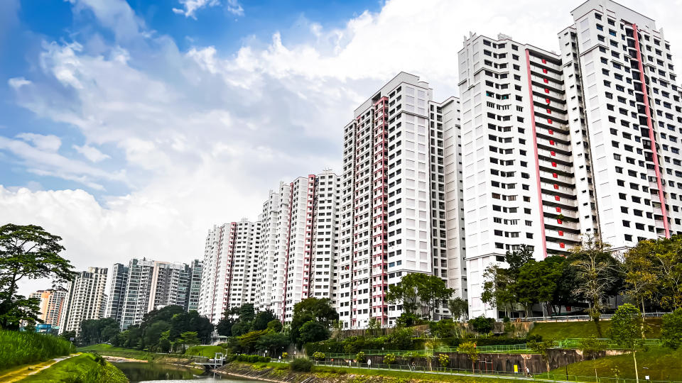 Housing and Development Board (HDB) flats against the backdrop of a clear day with blue skies.