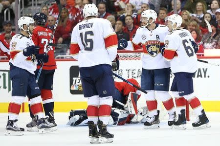 Oct 19, 2018; Washington, DC, USA; Florida Panthers left wing Jonathan Huberdeau (11) celebrates with teammates after scoring a goal on Washington Capitals goaltender Pheonix Copley (1) in the second period at Capital One Arena. Mandatory Credit: Geoff Burke-USA TODAY Sports