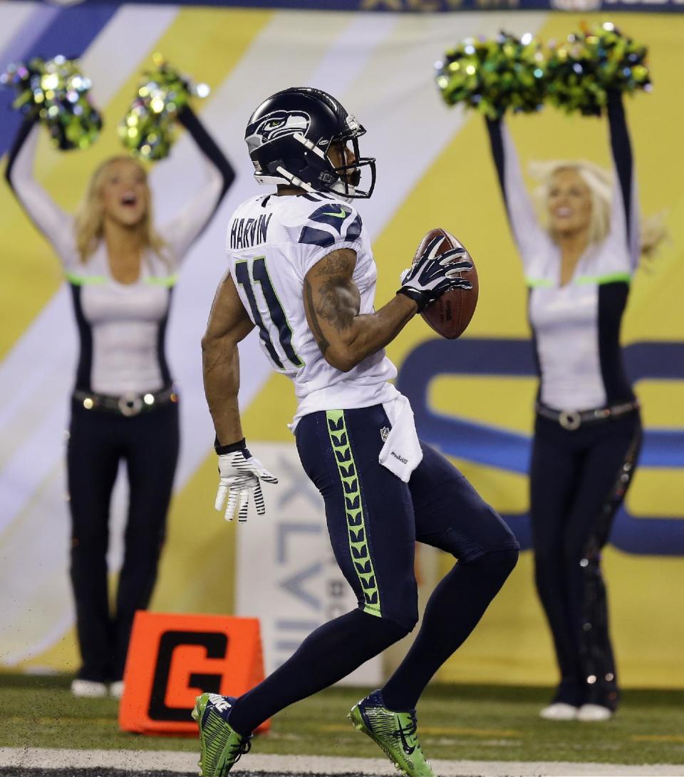 Seattle Seahawks' Percy Harvin celebrates after a touchdown against the Denver Broncos during the second half of the NFL Super Bowl XLVIII football game Sunday, Feb. 2, 2014, in East Rutherford, N.J. (AP Photo/Ben Margot)