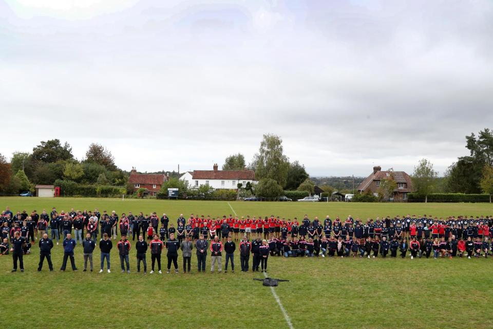 Players observe a minute's silence at East Grinstead rugby club, Kent, to pay their respects to police officer Sergeant Matt Ratana who was the head coach at the club. (PA)