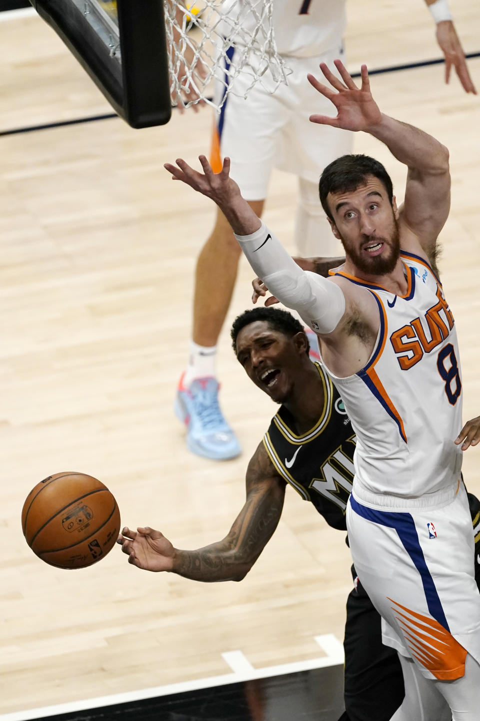 Atlanta Hawks guard Lou Williams (6) loses control of the ball as he drives against Phoenix Suns forward Frank Kaminsky (8) in the second half of an NBA basketball game Wednesday, May 5, 2021, in Atlanta. (AP Photo/John Bazemore)