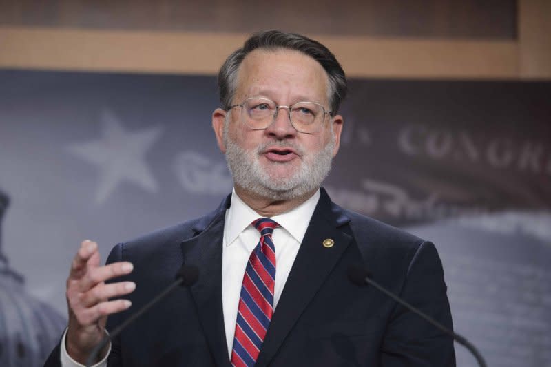 “Americans deserve to have confidence that their federal elected officials are making decisions that are in the best interest of the American public and not in the interest of any personal finances,” Sen. Gary Peters, D-Mich. said Wednesday at a press conference in Washington, saying the Senate’s Homeland Security and Governmental Affairs Committee would take the “historic step” to consider the bill on July 24. File Photo by Bonnie Cash/UPI