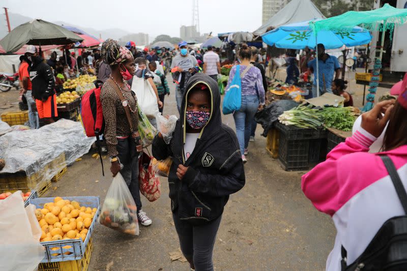 A teenager walks at the Coche wholesale market amid coronavirus (COVID-19) disease outbreak in Caracas