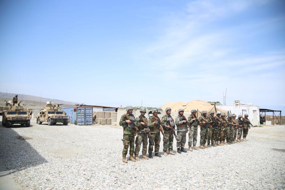 Afghan army soldiers secure a military base that was previously in use by US soldiers, in Haska Meyna district of Nangarhar province, 14 April 2021EPA