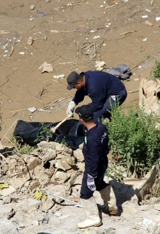 Some 10 months after dislodging the Islamic State group, fire crews and police are still extracting human remains from the ruins of Mosul