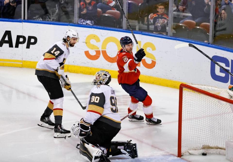 Vegas Golden Knights defenseman Nicolas Hague (14) looks on as Florida Panthers center Sam Bennett (9) skates after scoring the go ahead goal against Golden Knights goaltender Robin Lehner (90) during the second period of an NHL game at the FLA Live Arena on Thursday, January 27, 2022 in Sunrise, Fl.