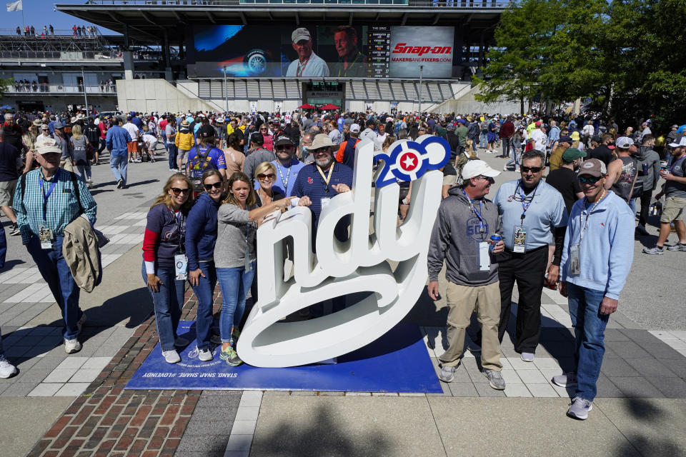 Fans gather for a photo before the start of the Indianapolis 500 auto race at Indianapolis Motor Speedway in Indianapolis, Sunday, May 30, 2021. (AP Photo/Darron Cummings)